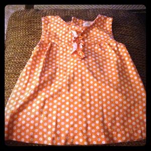 Orange and white polka dot top