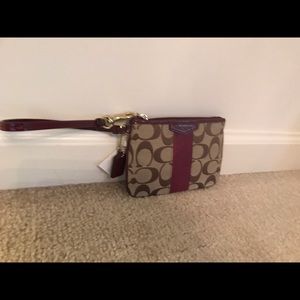 NWT burgundy and beige Coach wristlet