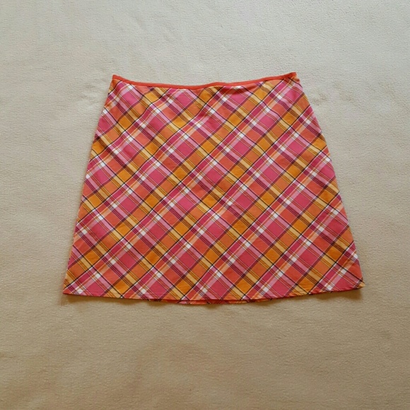 Wrapper pink & orange plaid skirt.