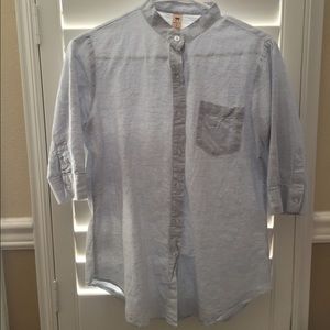 Light blue button down shirt without collar