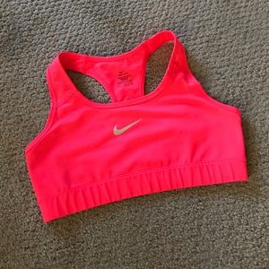 Bright pink Nike pro sports bra