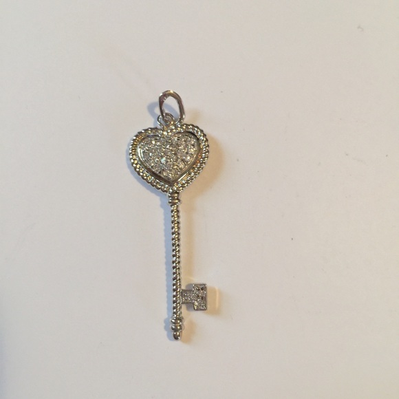 Sterling silver heart key with diamonds.