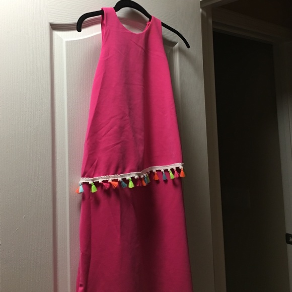 Fushia color dress.