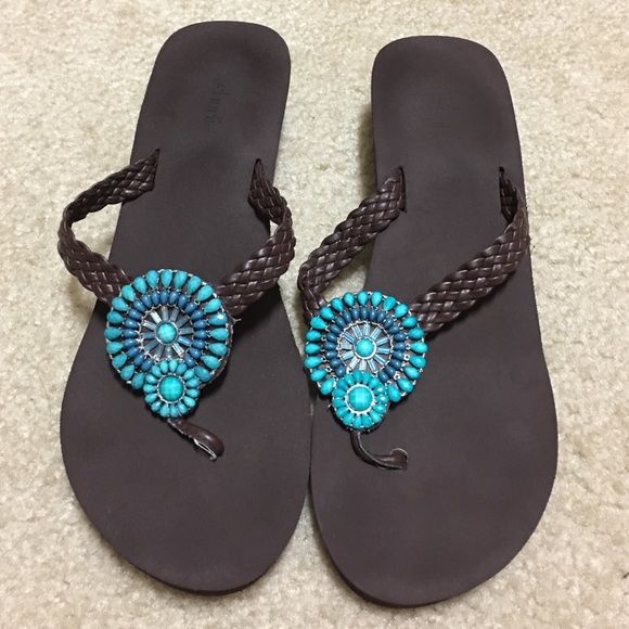 Pretty brown sandals with turquoise medallion!!