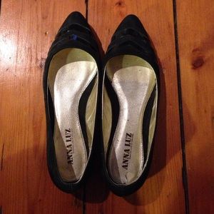 Black leather pointed flats