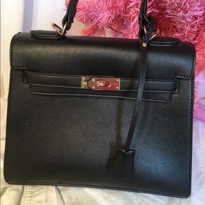 Very classy black trapezoid handbag with lock
