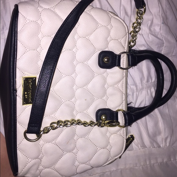Betsey Johnson purse with heart details.