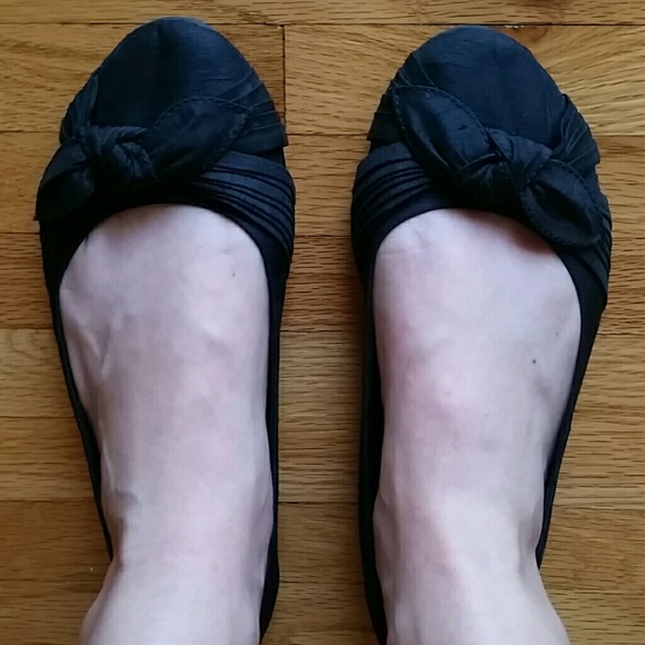 Black Rocket dog flats with bows.