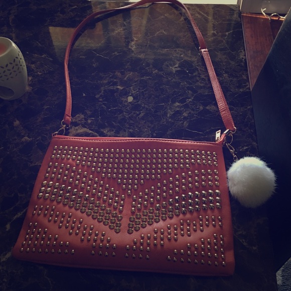 Over shoulder salmon purse with gold accents
