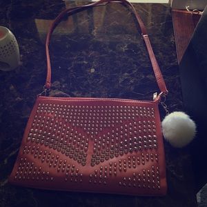 Over shoulder salmon purse with gold accents