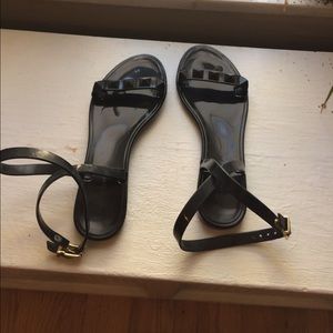 Black sandals with wrap around ankle strap.
