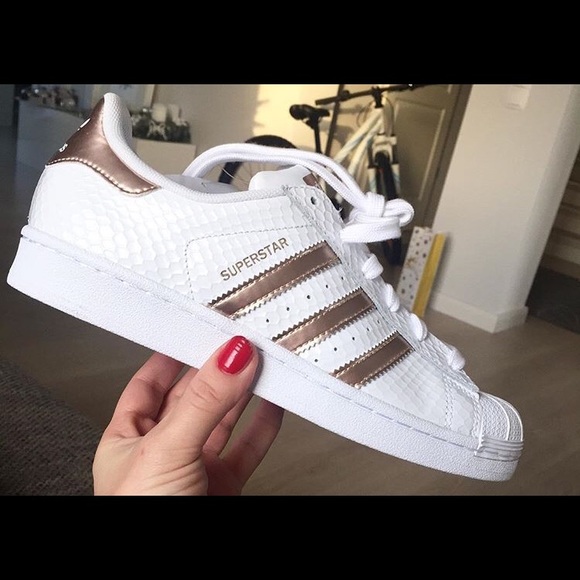 white superstars with rose gold stripes