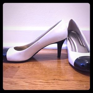 Barely worn twice white pumps with black toe caps!