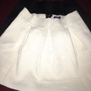 1 black and 1 white Mini skirt