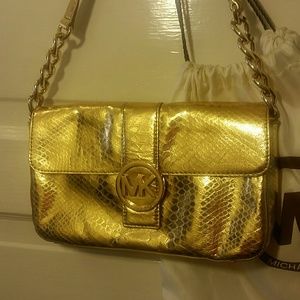 Gold Michael Kors handbag.