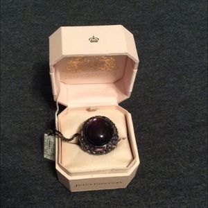 Purple stone and gem ring.