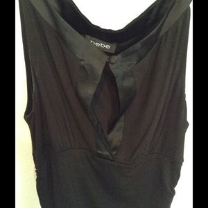 BEBE sleeveless top with deep V neck.