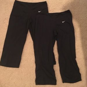 2 pairs of Nike Dri-Fit crop workout pants.