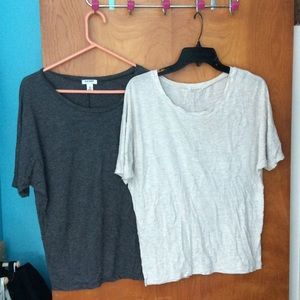 Two shirts, have got pink speckling on them