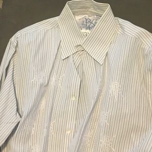 Long sleeve Buckle button down shirt.
