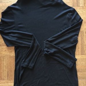 Black soft turtle neck. Light weight