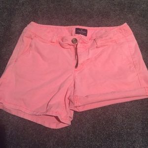 Neon orange/peach colored shorts