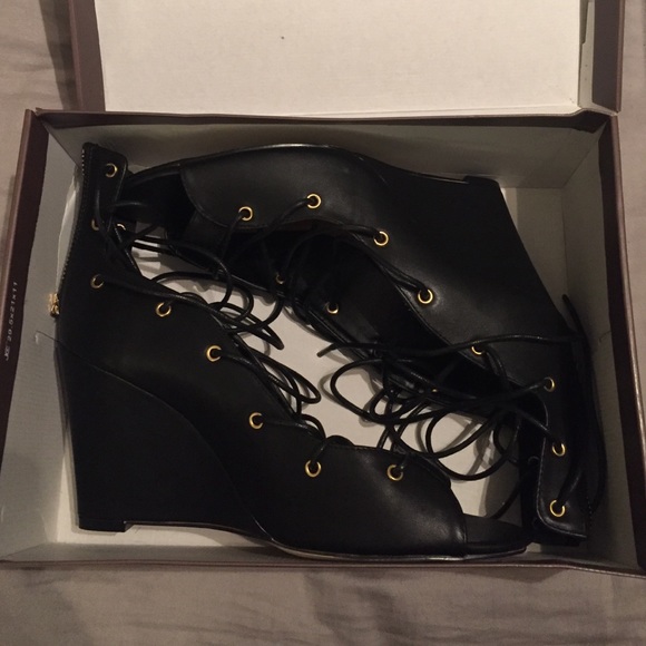 Never worn Leila Stone lace up wedge heels