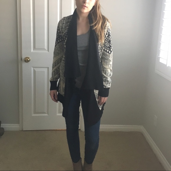 Cream geometric sweater with black details