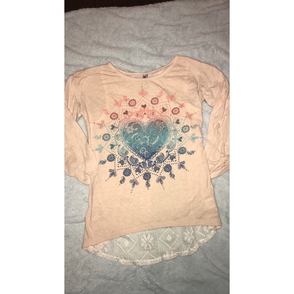 cream colored long sleeve top with lace back