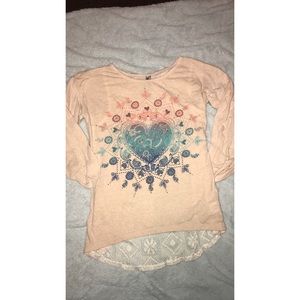 cream colored long sleeve top with lace back