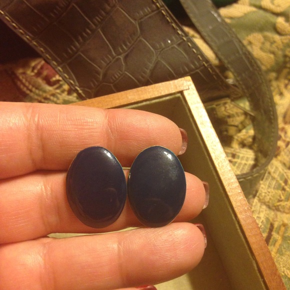 Navy blue pierced earrings.