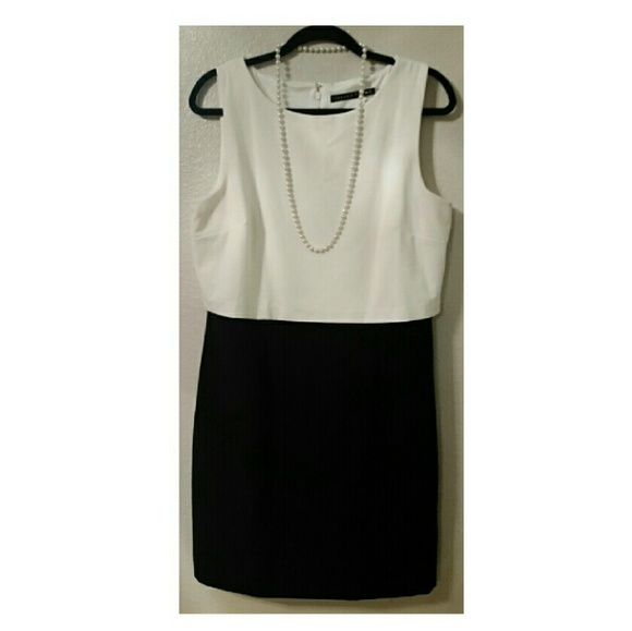 Classic black and white dress with a gold zipper.