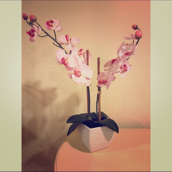 Vase with artificial flowers