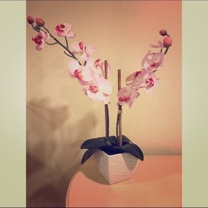 Vase with artificial flowers