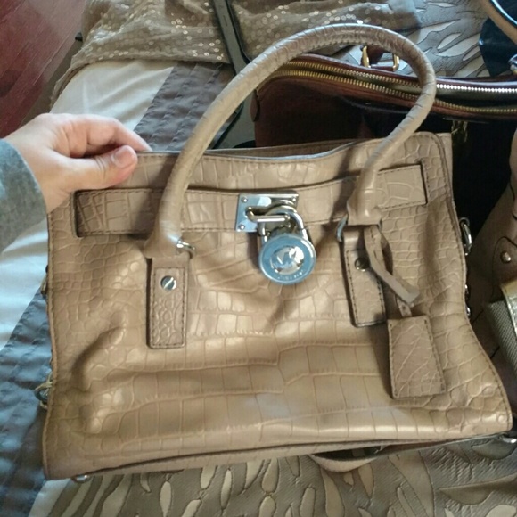 Michael Kors tan/beige crocodile print hand bag