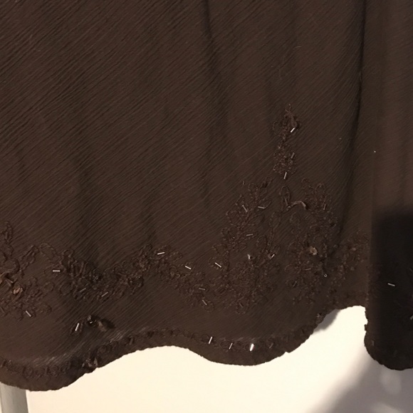 A dark brown skirt with embellishments at bottom - Picture 2 of 2