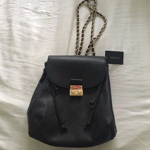 Black and gold mini backpack purse