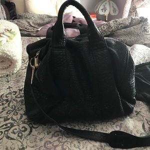 Melrose Glam studded bottom leather purse.