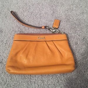 Coach mustard color leather wristlet