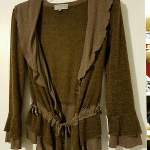 Beautifully flowing ruffled tie front sweater