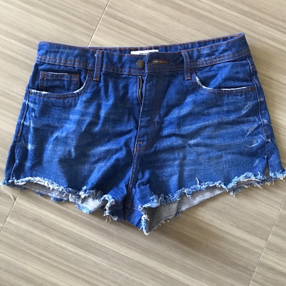 High-waisted distressed denim shorts