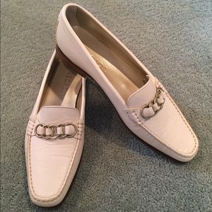 Escada loafers with brass chain details.
