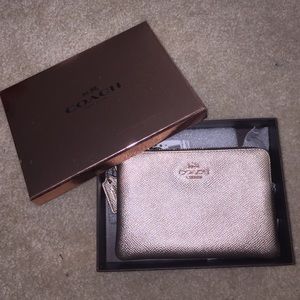 brand new Coach rose gold wristlet