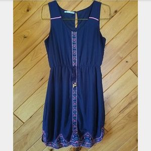 Navy blue dress with pink trim.