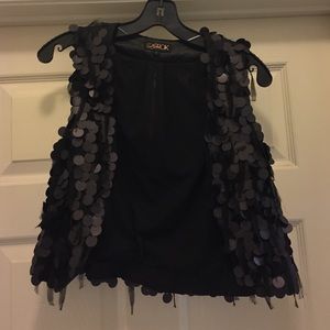 Black vest with large black discs/sequins