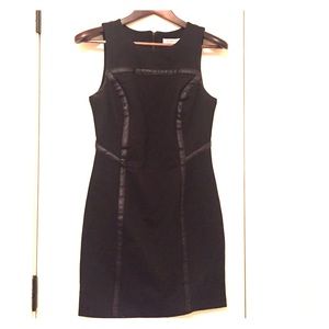 Never worn black with leather trim mini BCBG dress