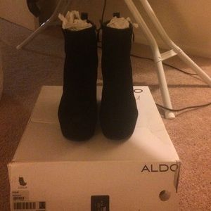 High platform heel. Worn twice. Still in box.