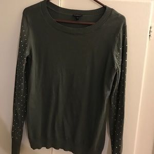 Express sweater with gold studded sleeves.