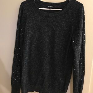 Express sweater with rhinestone studded sleeves.