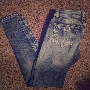 buckle black skinny jeans